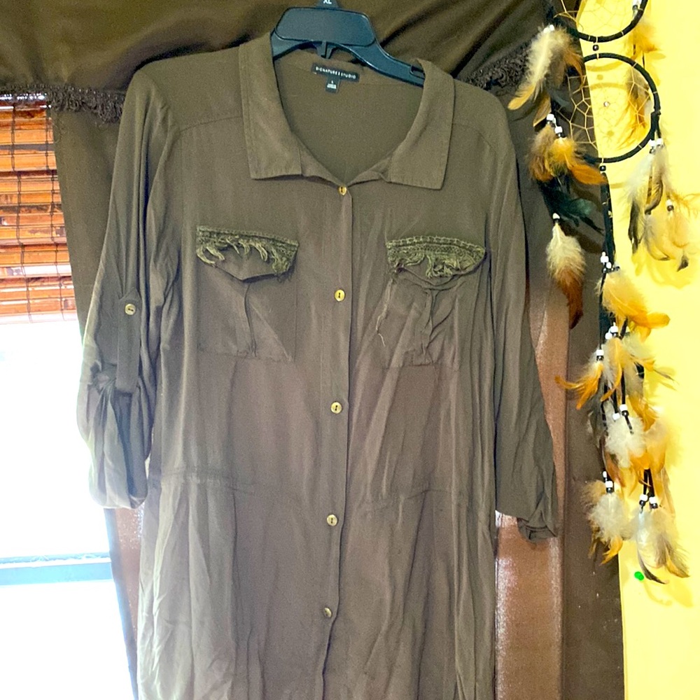 This is a signature studio dark green blouse